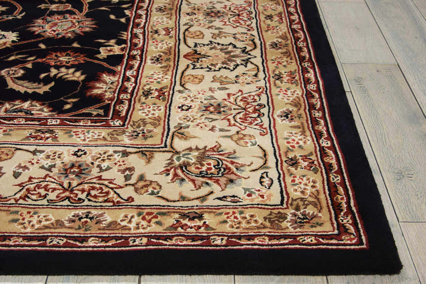 Close up of the navy Nourison 2000 Persian rug showing its floral pattern and handmade texture. Clearance.