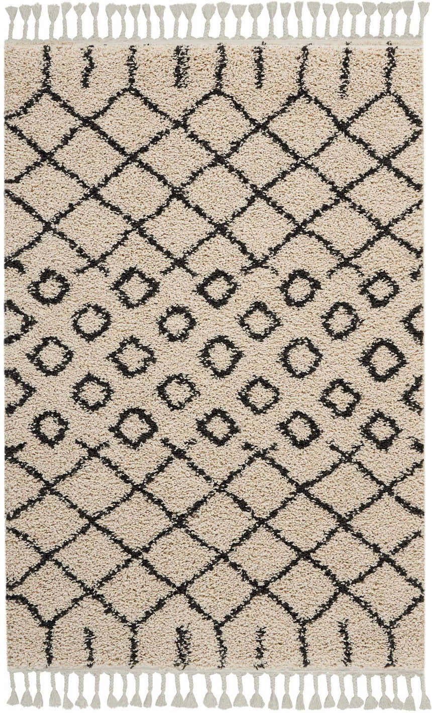 Close-up of Nourison Moroccan Shag Cream Tribal rug, featuring a diamond pattern and fringe detail.