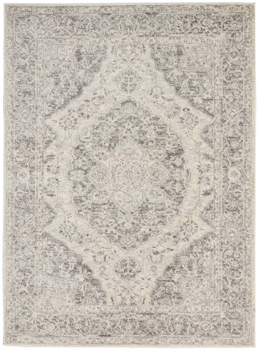 Close-up of the Nourison Tranquil Ivory Grey Vintage Area Rug, showing its intricate chestnut-toned vintage pattern.