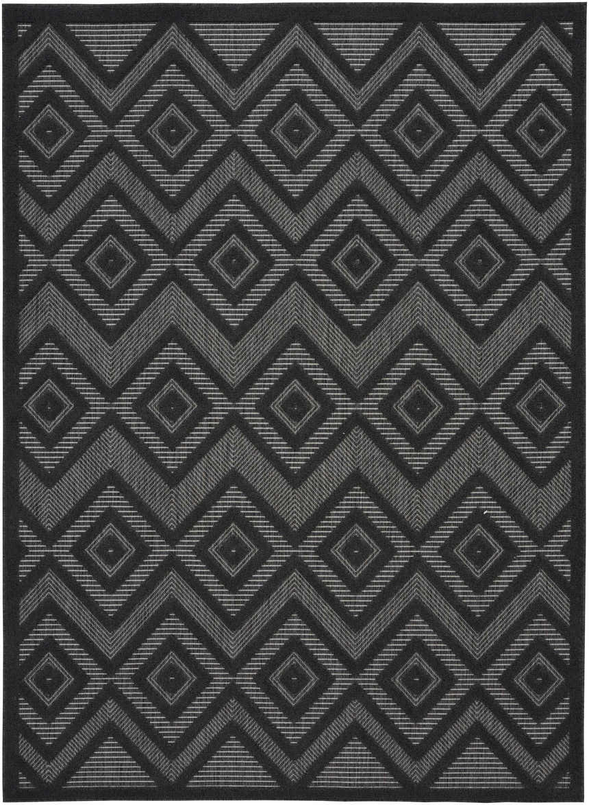 Close-up of Nourison Versatile Charcoal Black Modern Area Rug. Geometric diamond pattern in black and taupe.