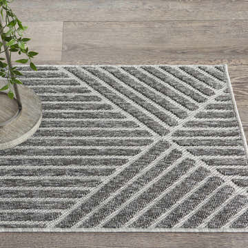 Close-up of the Nourison Cozumel Dark Grey rug, featuring a modern geometric pattern and textured weave.