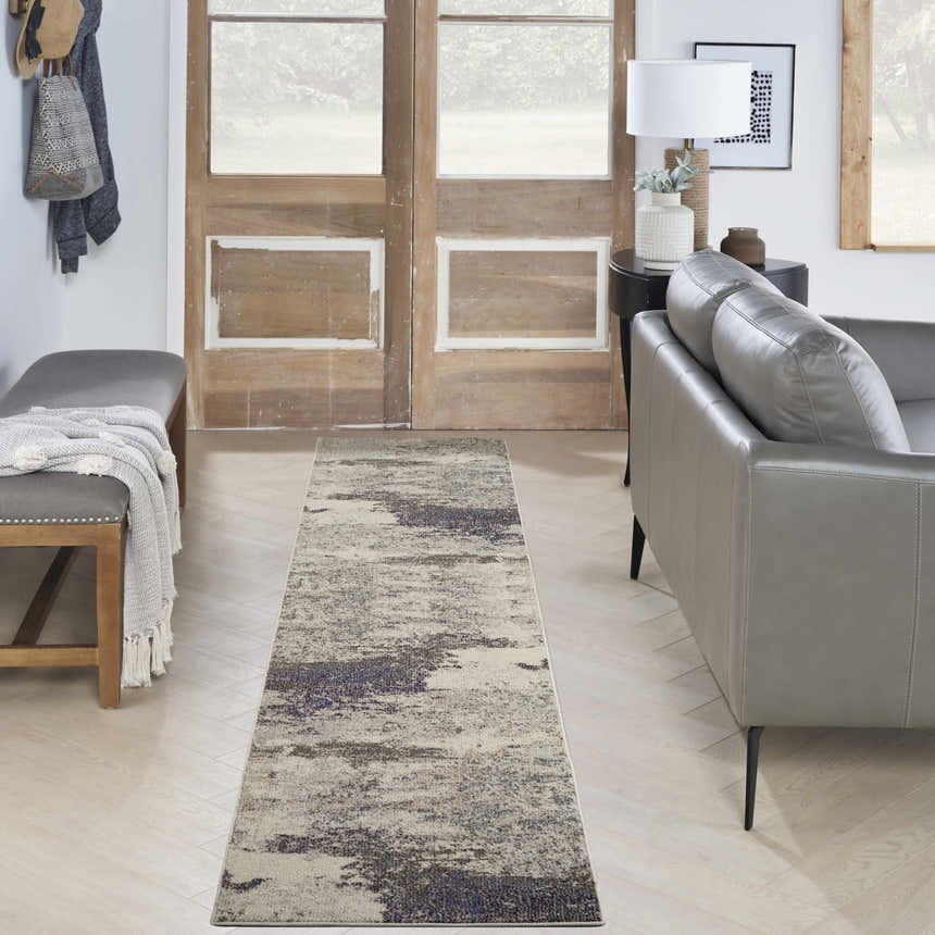 Entryway with Nourison Celestial Ivory Grey runner rug, gray bench, and leather sofa. Modern, neutral decor.