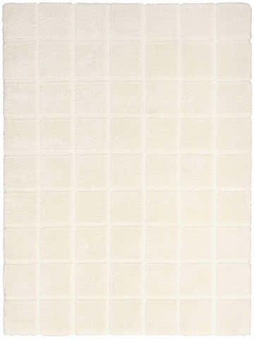 Close-up of the ivory DKNY West End Ave rug. Shag texture with a subtle, modern square pattern.