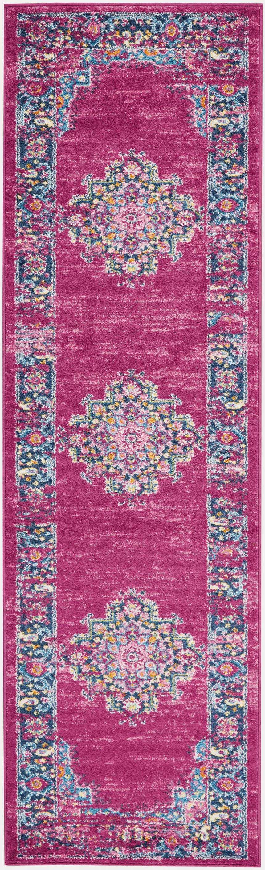 Close-up of Nourison Passion Fuchsia rug. Bohemian style with floral medallions and border on a vibrant fuchsia background.