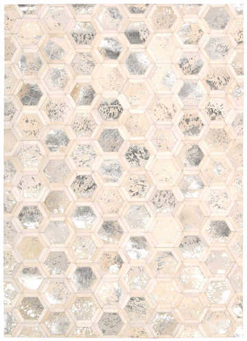 Close-up of the Michael Amini City Chic Snow rug. Features a geometric hexagon pattern in snow white, silver, and beige tones.