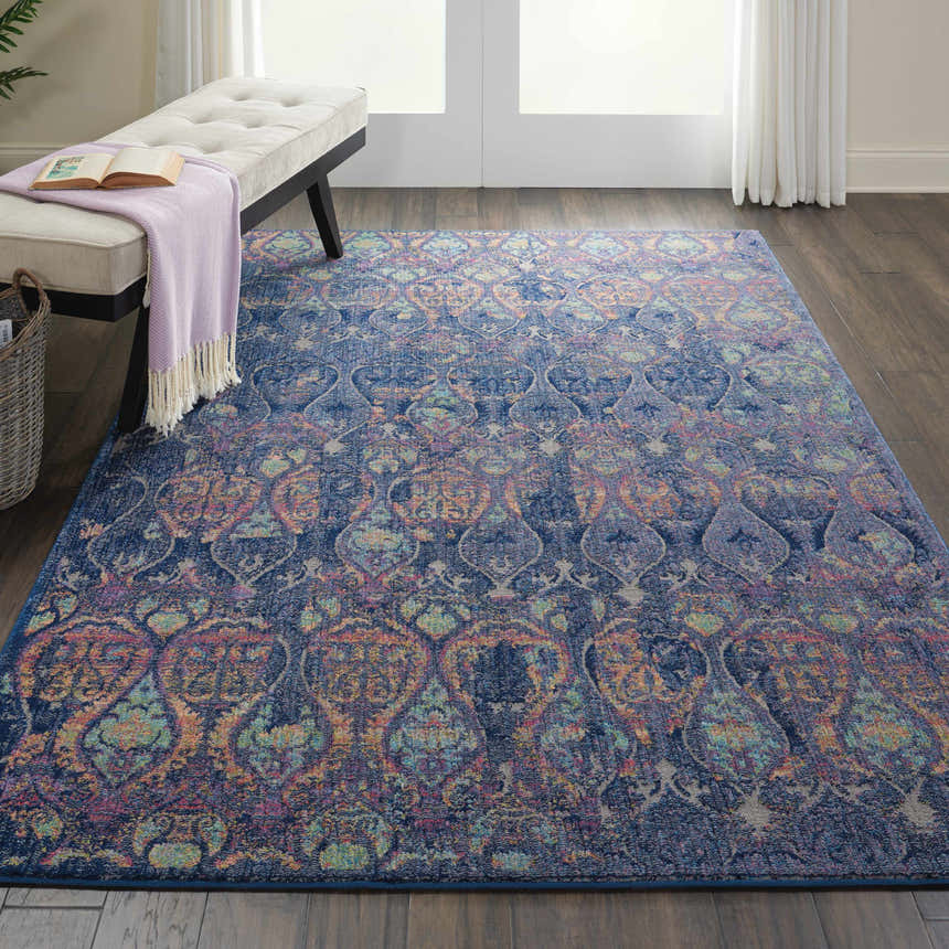 Entryway with bench and Nourison Ankara Global Navy Multicolor Area Rug on dark wood floors.