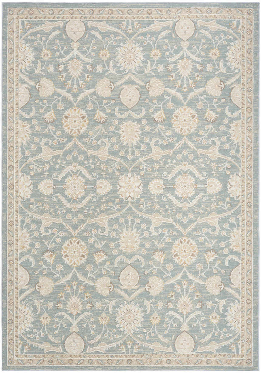 Close-up of the Nourison Isla Blue Vintage Indoor Area Rug, featuring a floral pattern and light blue tones.