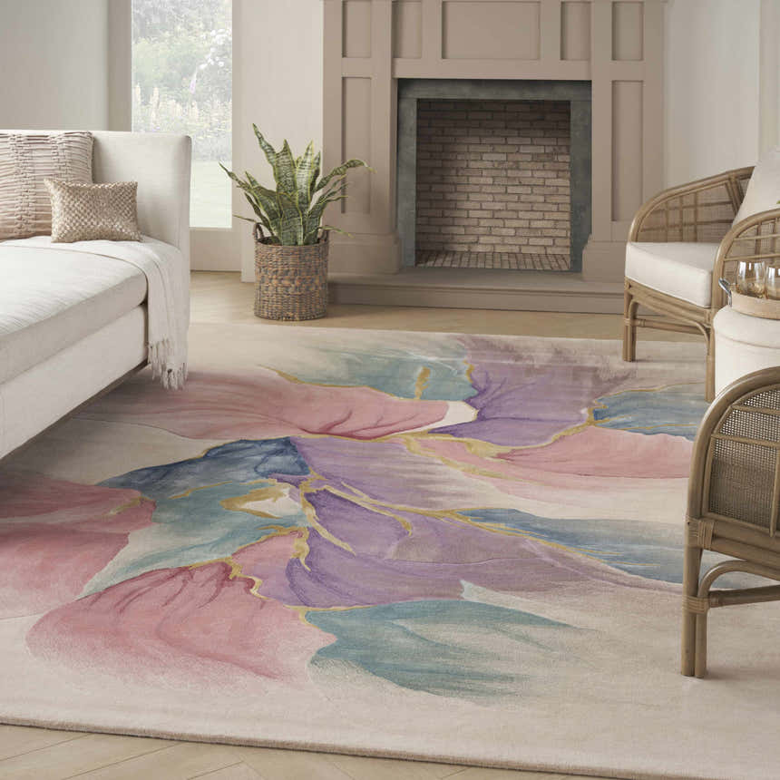 Living room scene with a Nourison Prismatic Ivory rug featuring a floral pattern in pink, blue, and purple hues.