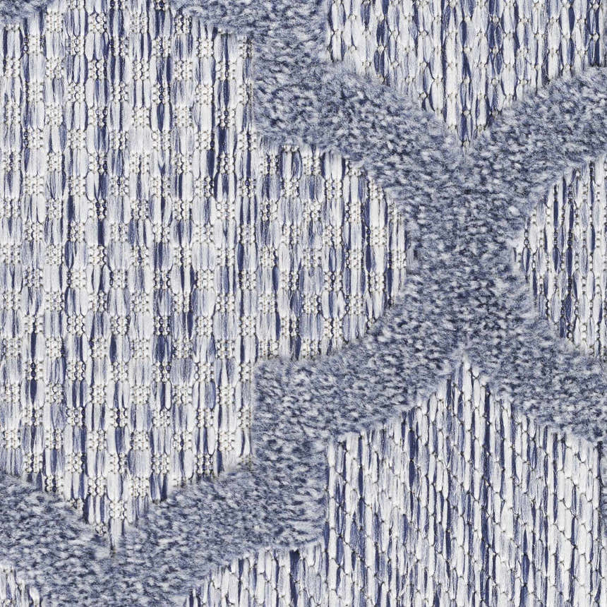 Close-up of the Nourison Easy Care Denim Blue rug showing texture and geometric pattern.