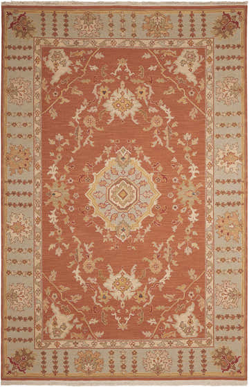 Handmade Nourison Nourmak Rust Indoor Area Rug with a traditional floral pattern and a light blue border.