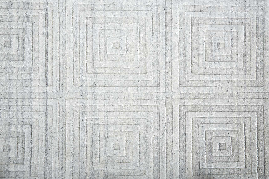Close up of the Feizy Redford Silver Gray rug showing a geometric square pattern and wool viscose texture. Texture