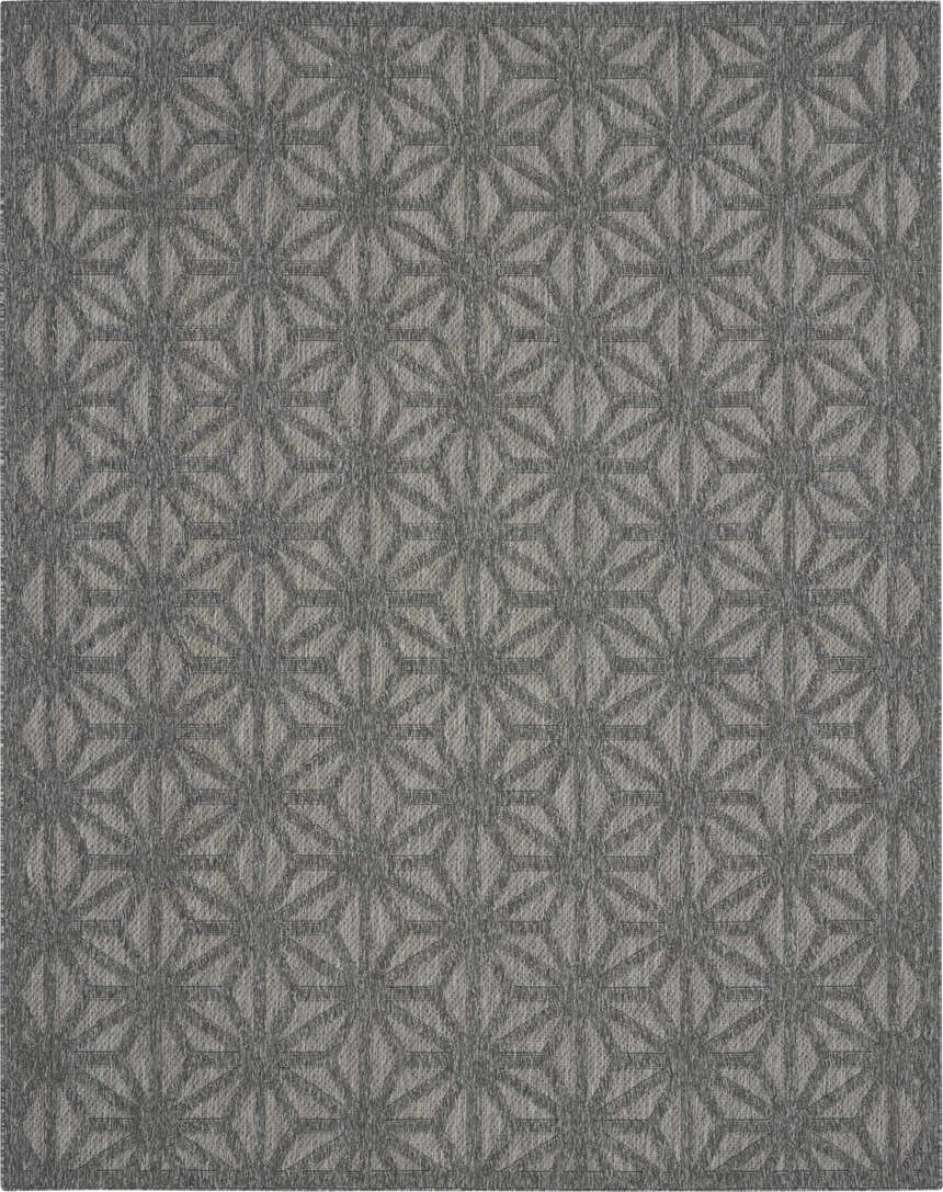 Close-up of the Nourison Cozumel Dark Grey rug featuring a geometric star pattern and subtle texture.