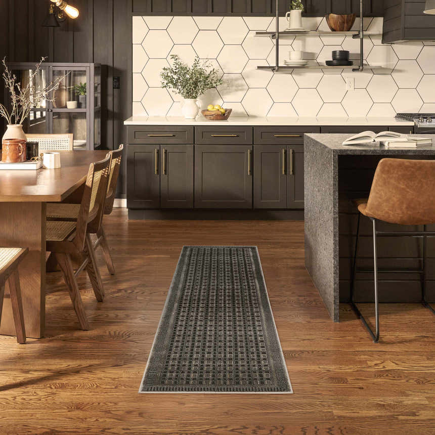 Modern kitchen with wood floors and Nourison Nordic Black Taupe Art Deco runner rug.