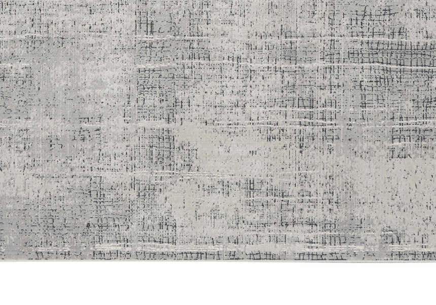 Close up of the Calvin Klein CK970 Vapor Grey Ivory Rug. Modern design with chestnut accents and a subtle grid pattern.