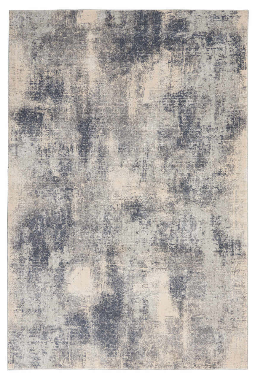 Close-up of the Nourison Rustic Textures Blue Ivory Area Rug, showcasing its distressed, mid-century modern design.