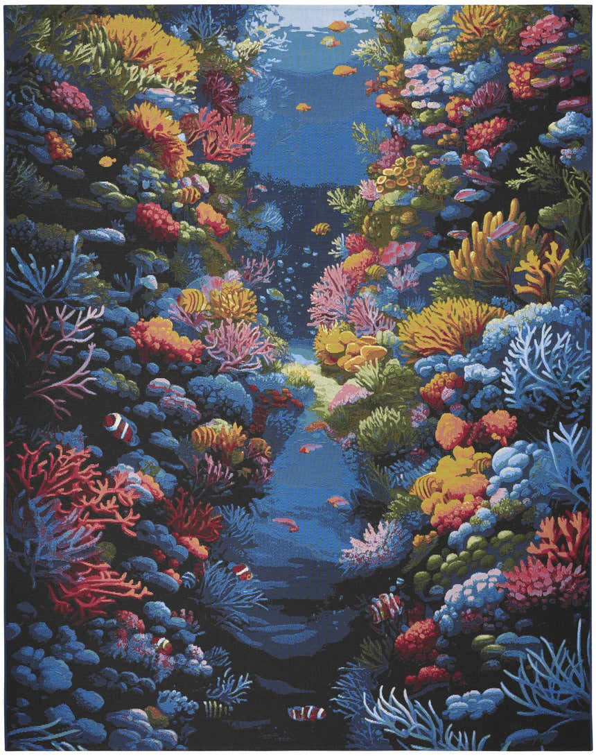 Close-up of the Nourison Color Splash rug featuring a vibrant coral reef and fish design. Multicolor coastal style.