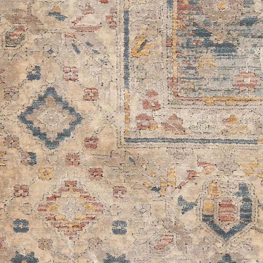 Close-up of the Nourison Luxurious Ivory Blue Vintage Area Rug, showcasing its detailed chestnut, blue, and ivory vintage pattern.