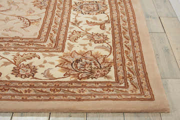 Close up of the handmade Nourison 2000 Sand Persian rug showing floral pattern and sandstone, brown, and cream colors.