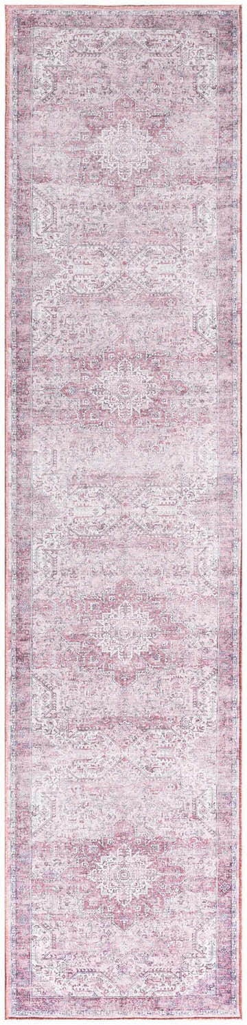 Close-up of Nourison Pink Vintage Indoor Washable Area Rug, a machine-made runner with a faded traditional pattern.