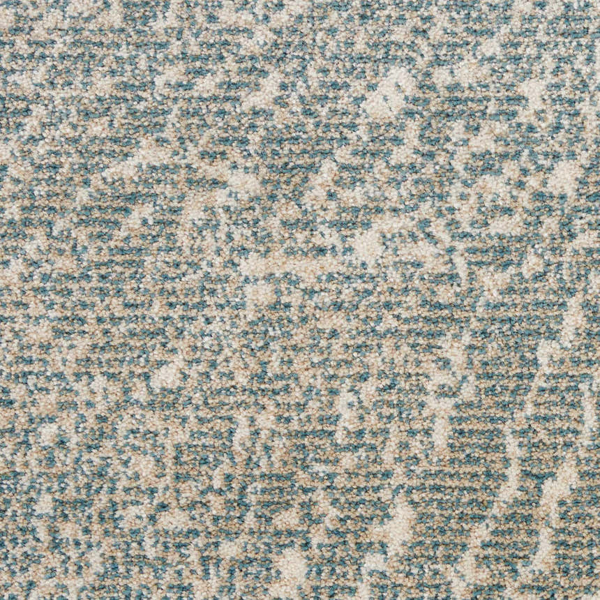 Close-up of Inspire Me! Home Decor Elegance Grey rug showing a speckled pattern of beige and blue.