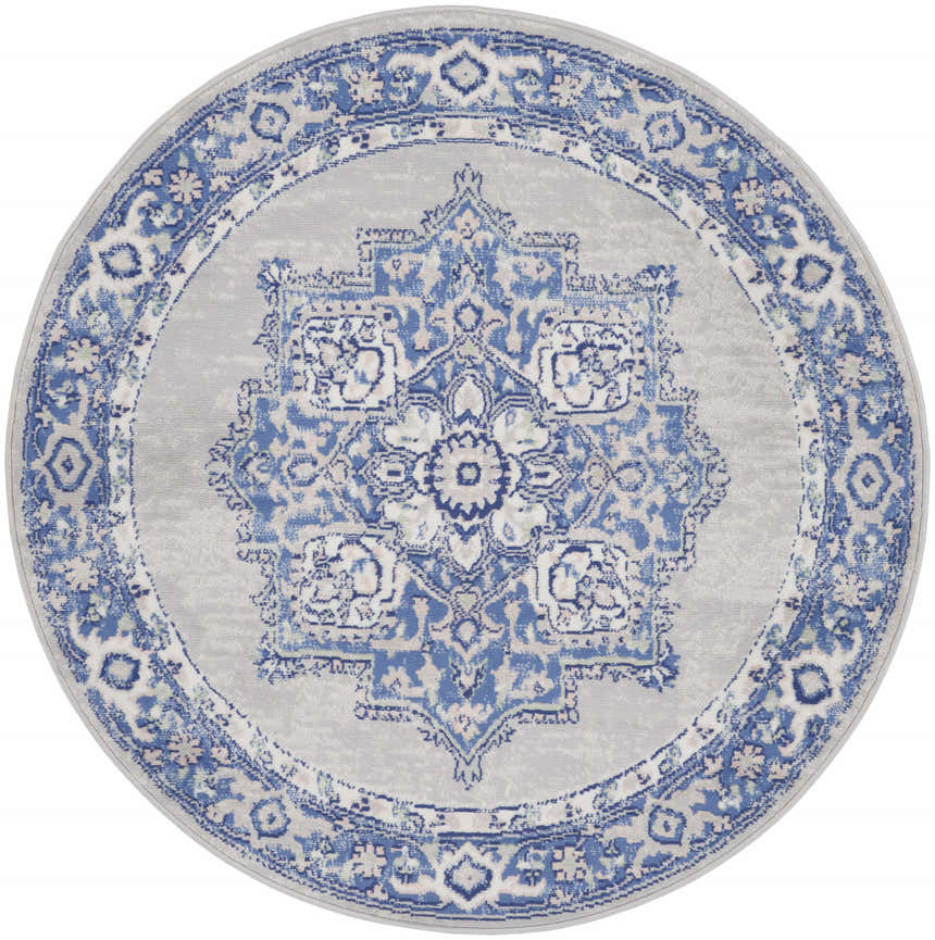 Round Nourison Whimsicle rug, grey and blue farmhouse style. Floral medallion pattern with ornate border.
