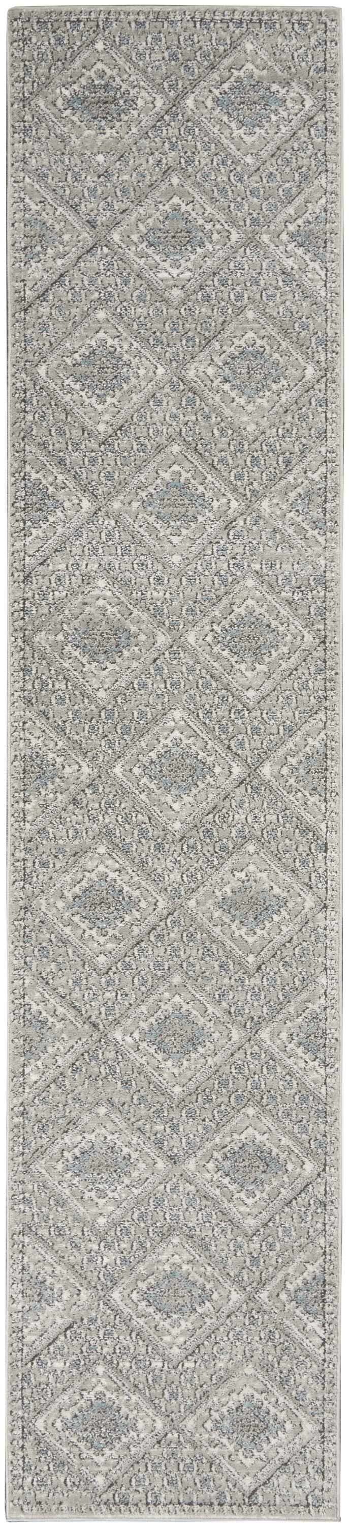 Close-up of Nourison Quarry Grey Ivory Blue Southwestern rug with diamond pattern and subtle chestnut accents.