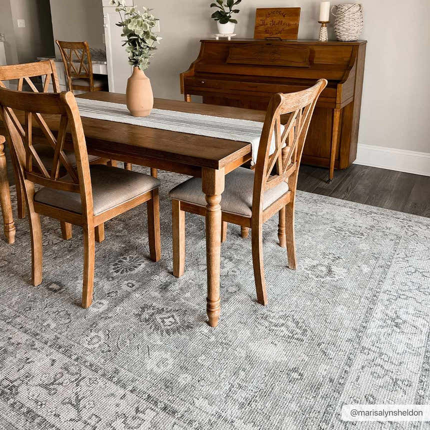 Farmhouse dining room with wood table and Davina Becki Owens rug in charcoal, light gray, and white. Roomscene-Rectangle