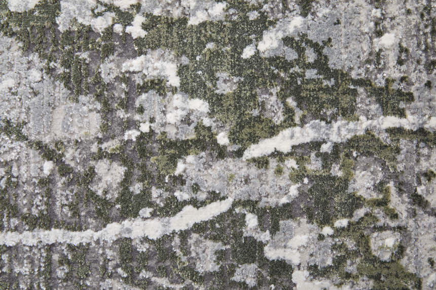 Close-up of the Feizy Cadiz rug. Abstract design in gray, green, and taupe with soft, textured pile. Texture