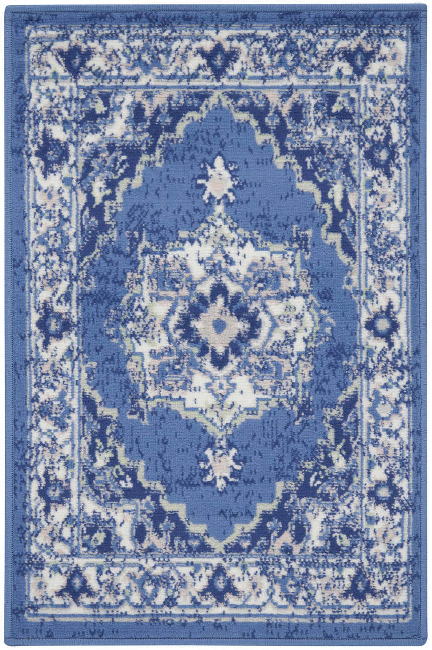 Detailed view of the Nourison Whimsicle Navy Farmhouse Indoor Area Rug, featuring a traditional, intricate pattern.