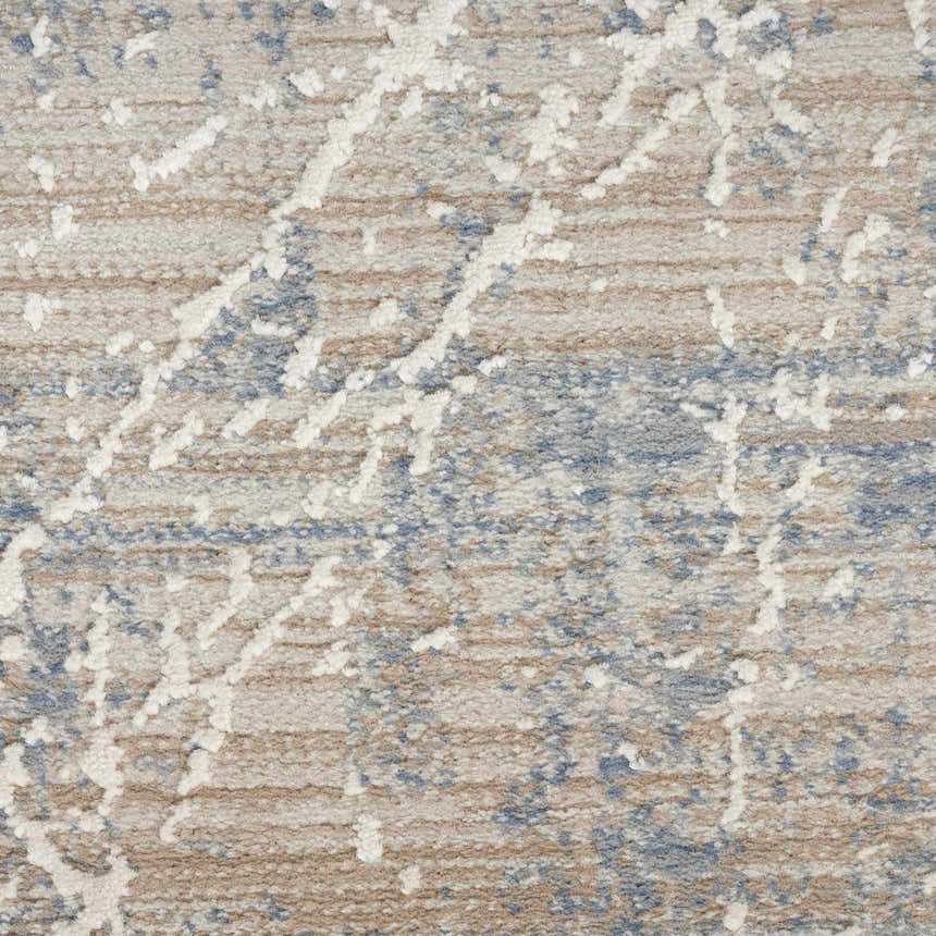 Close-up of Nourison Exhale Beige Blue rug. High pile with abstract white design over beige and blue striations.