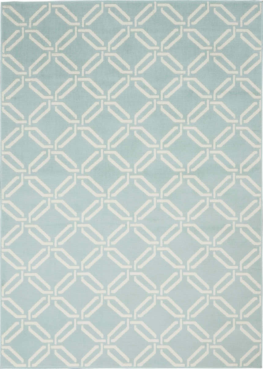 Close-up of Nourison Jubilant Green rug. Coastal style with a geometric, linked diamond pattern in white on a light green background.