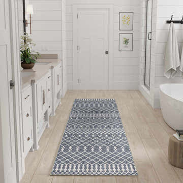 White bathroom with Nourison Astra Denim rug runner. Bohemian style.