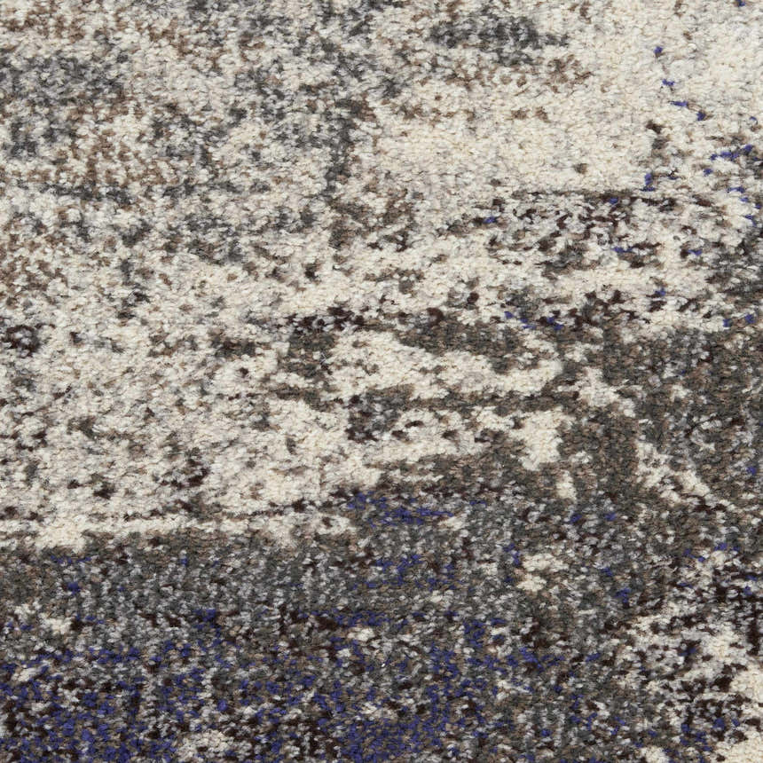 Close-up of Nourison Celestial Ivory Grey rug showing texture and abstract pattern in chestnut, grey, ivory, and blue.