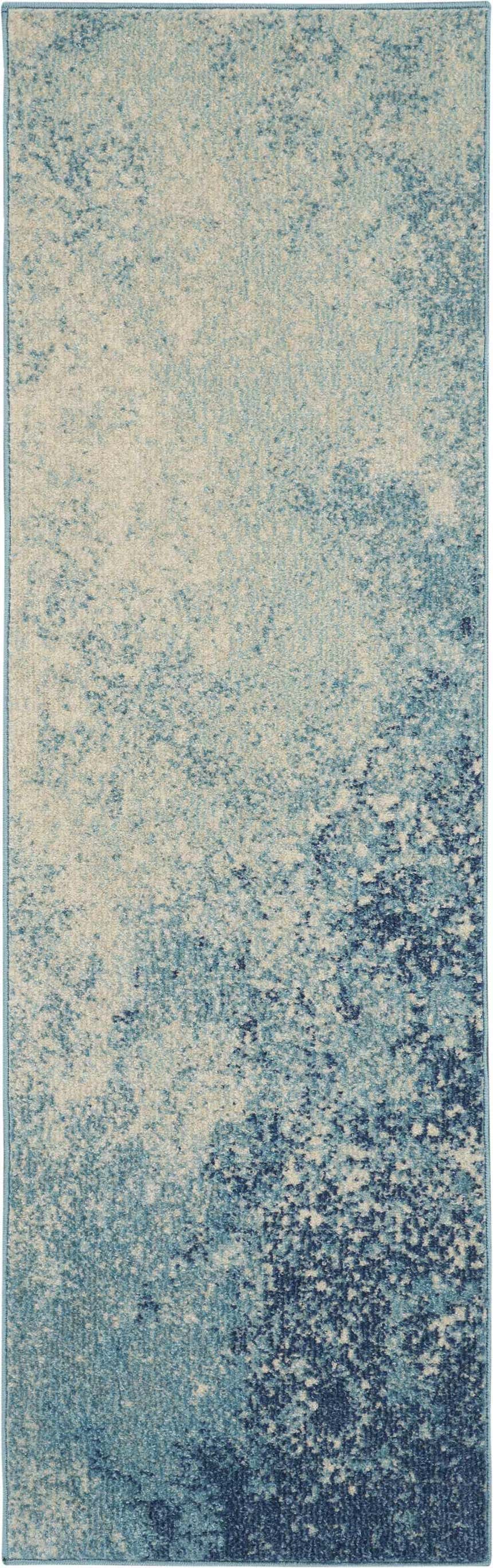 Close-up of the Nourison Passion Navy Light Blue rug. Abstract pattern in shades of navy, light blue, and cream.