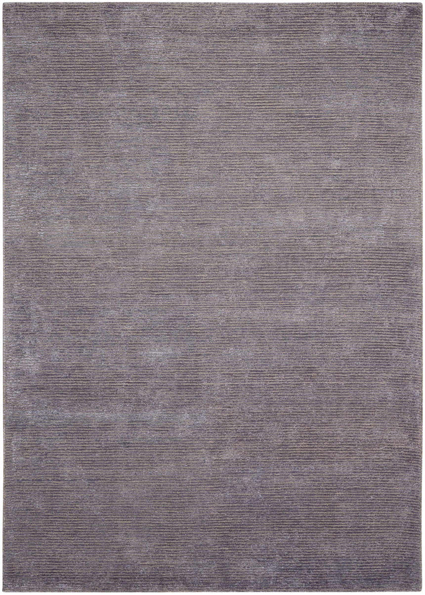 Close-up of the Calvin Klein Home Ravine Nightshade rug. The rug has a subtle horizontal ribbed texture and a nightshade color.