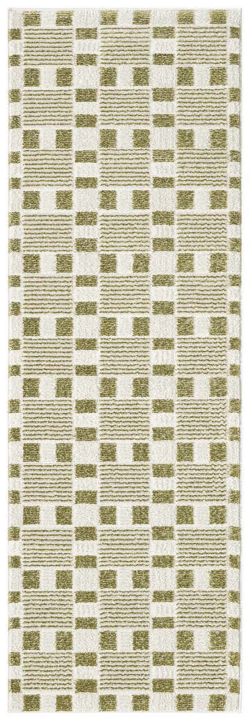 Close-up of the Nourison Nordic Green Modern Indoor Area Rug featuring a geometric, green and white pattern.