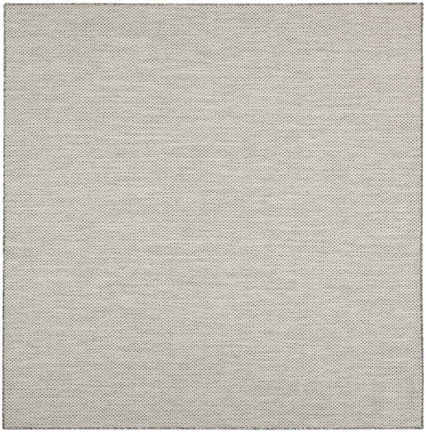 Close-up of the Nourison Courtyard Ivory Silver rug showing its woven texture and subtle chestnut and silver pattern.