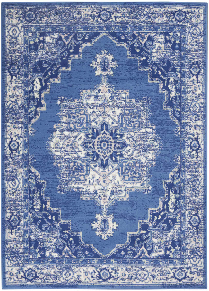 Detailed view of the Nourison Whimsicle Navy Farmhouse Area Rug, featuring a traditional medallion pattern in shades of blue and white.