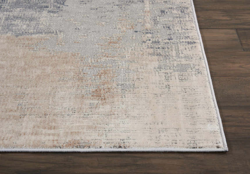 Close up of the Nourison Rustic Textures Beige Grey rug showing its abstract pattern and soft texture.