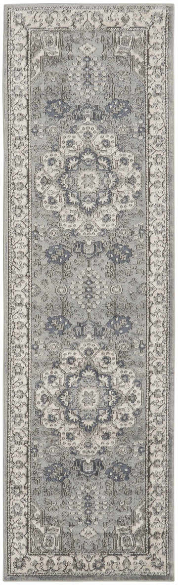 Detailed Nourison Quarry Grey Ivory Vintage Area Rug with a distressed floral pattern and chestnut accents.