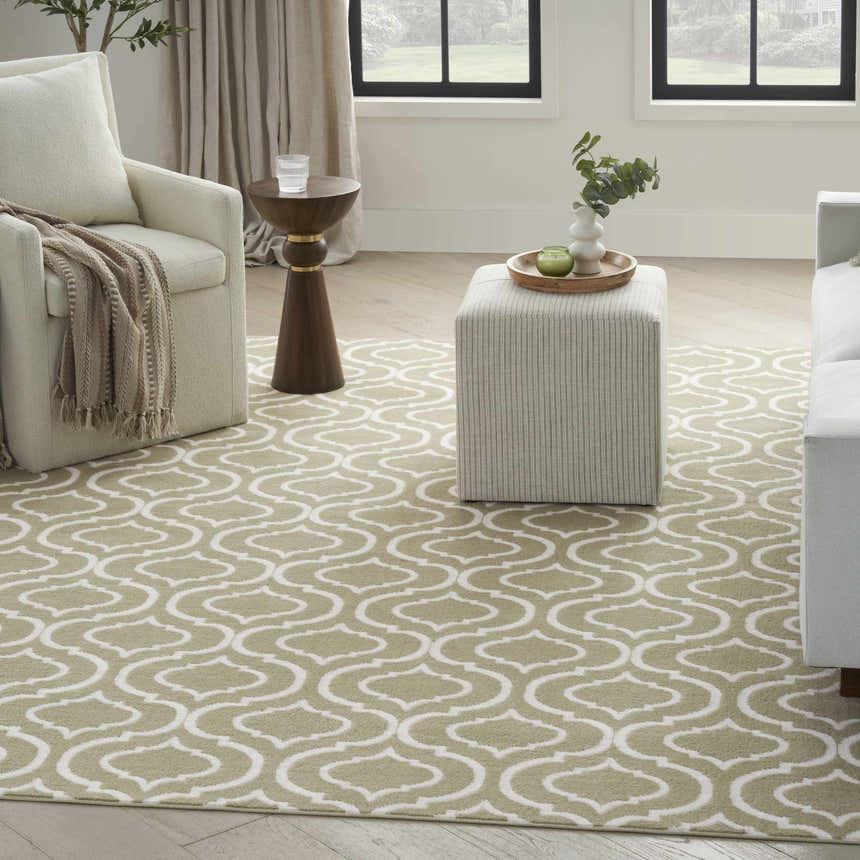 Living room scene with the Nourison Jubilant Olive rug, neutral furniture, and natural light. Contemporary style.