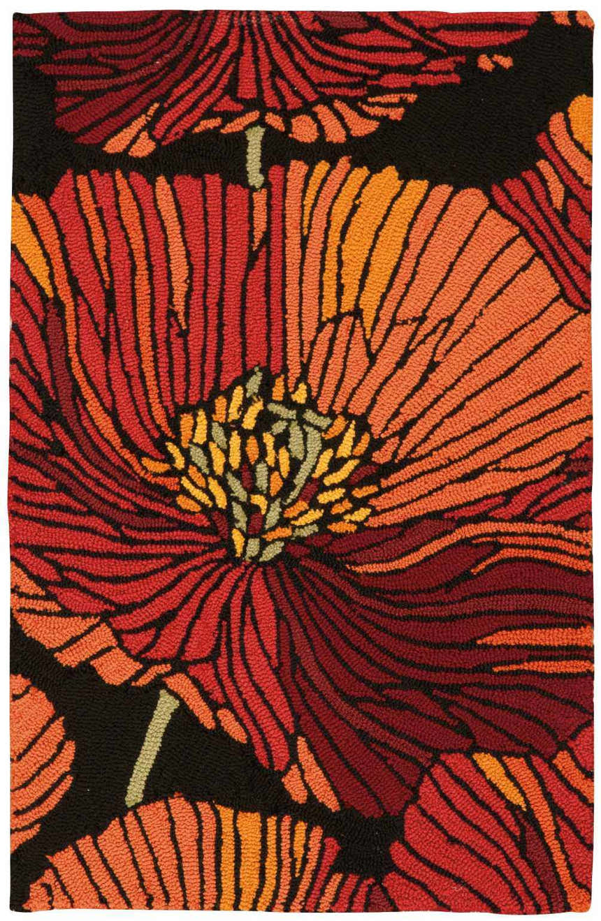 Close-up of Nourison Fantasy Black rug with a bold floral pattern in shades of red, orange, and black. Handmade texture.