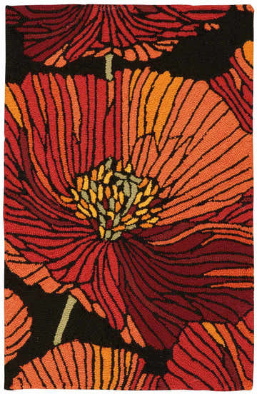 Close-up of Nourison Fantasy Black rug with a bold floral pattern in shades of red, orange, and black. Handmade texture.