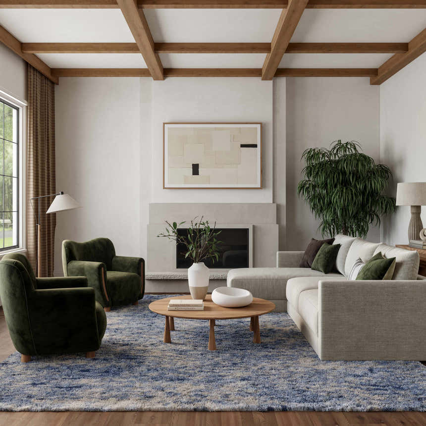 Living room with light sofa, green chairs, and Nourison Dreamy Shag Light Blue rug.