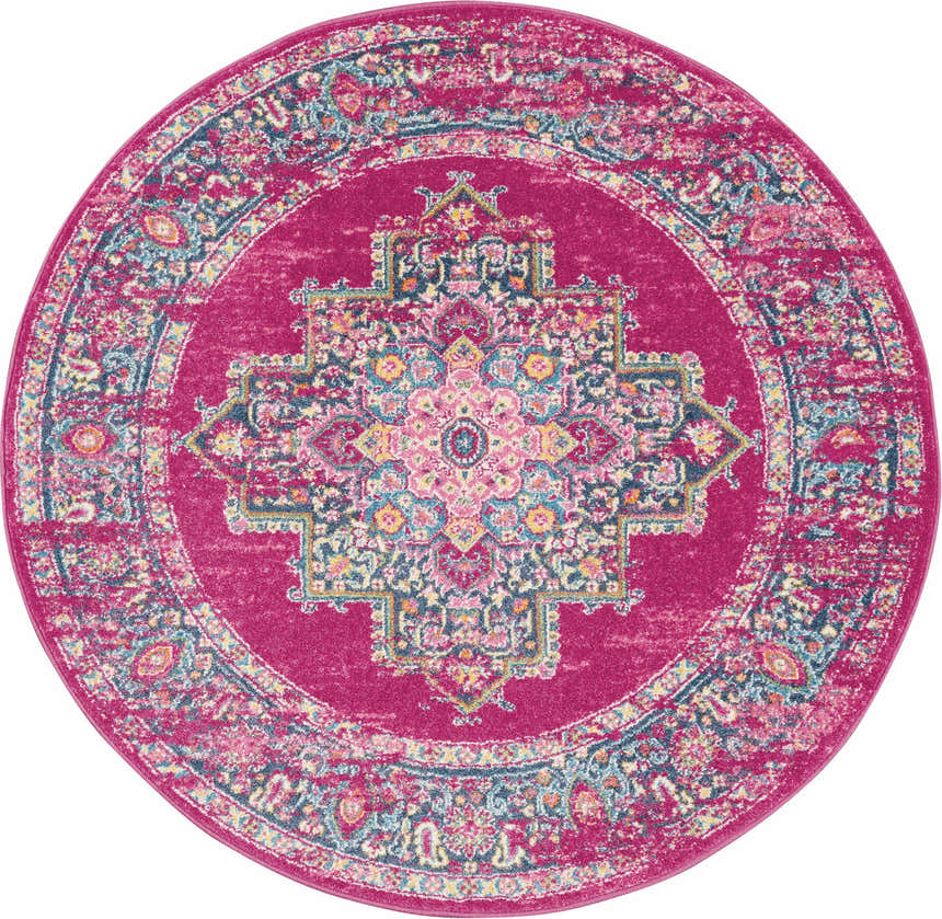 Round Nourison Passion Fuchsia rug. Bohemian style rug with a central medallion pattern. Fuchsia, pink, blue, and yellow tones.