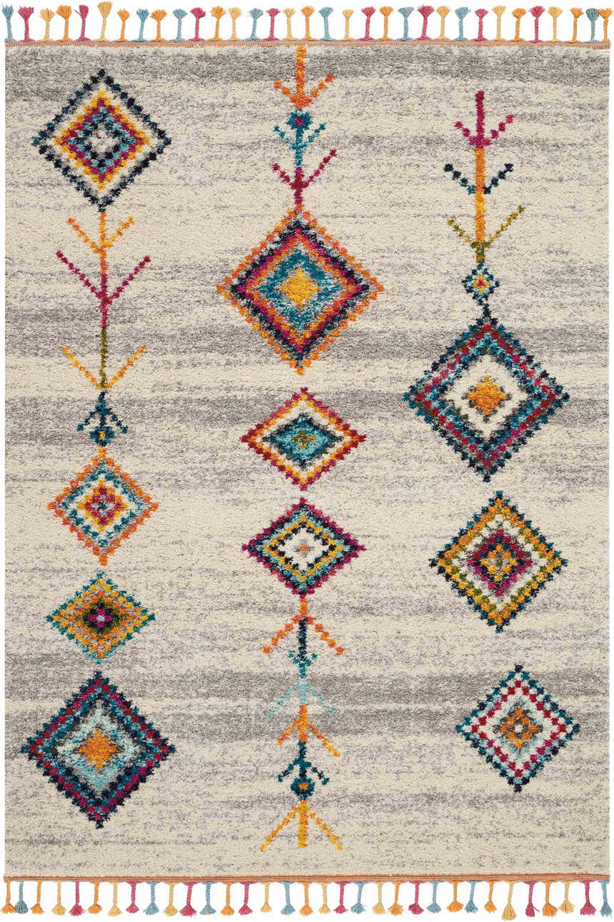 Close-up of Nourison Nomad Cream Grey Tribal Rug. Features colorful diamond pattern and tassels on a textured cream and gray base.