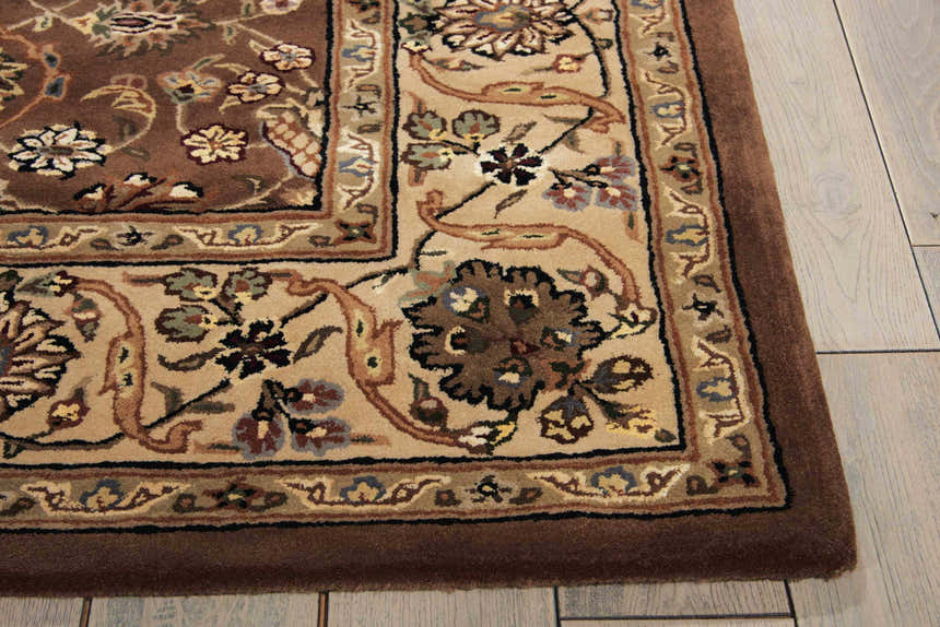 Close-up of the Nourison 2000 Mushroom area rug. Features a traditional floral pattern in mushroom, beige, and brown tones.