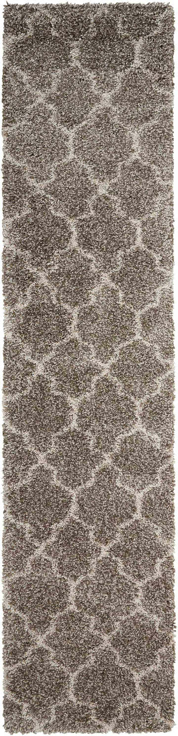 Close-up of the Nourison Amore Stone Shag rug. Plush, high-pile shag with a subtle sandstone color and organic, flowing pattern.