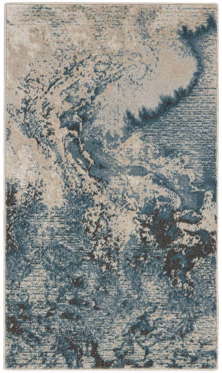 Close-up of Nourison Maxell Ivory/Teal rug. Abstract pattern in shades of teal, ivory, and chestnut. Modern design.