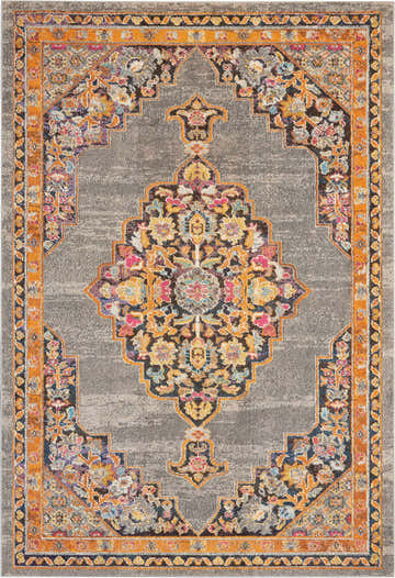 Close-up of Nourison Passionate Grey Bohemian Indoor Area Rug with orange border and floral medallion pattern.